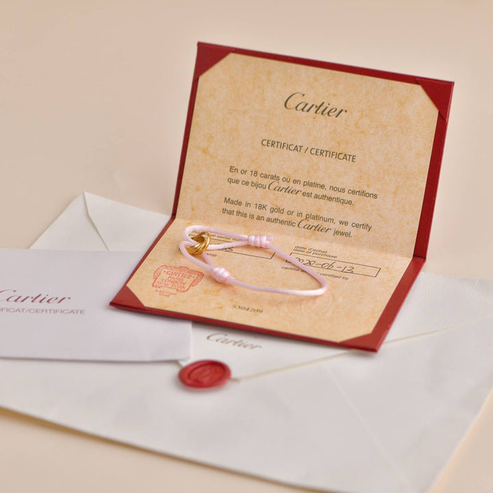 Cartier Trinity 18K Yellow Gold Pink Silk Cord Bracelet
