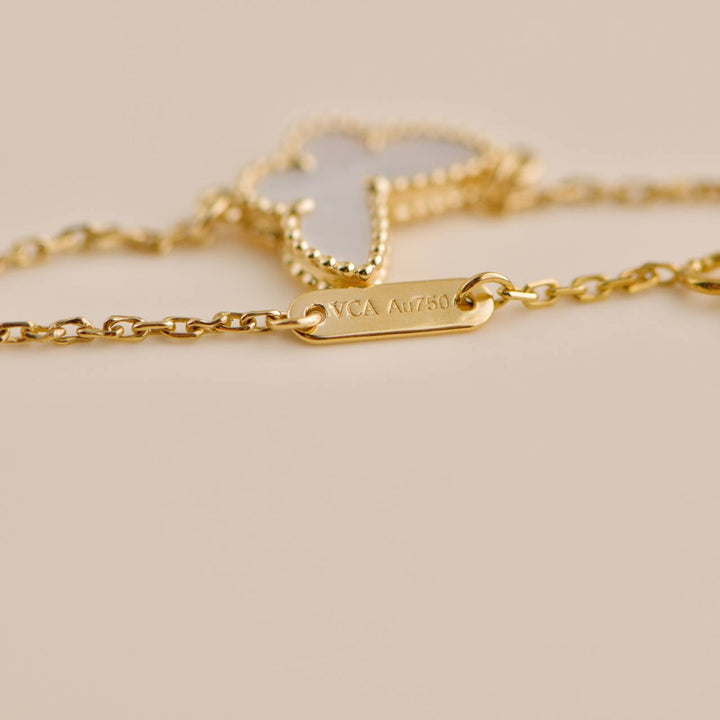 Second Hand Van Cleef & Arpels Sweet Alhambra Mother of Pearl Butterfly 18k Yellow Gold Bracelet