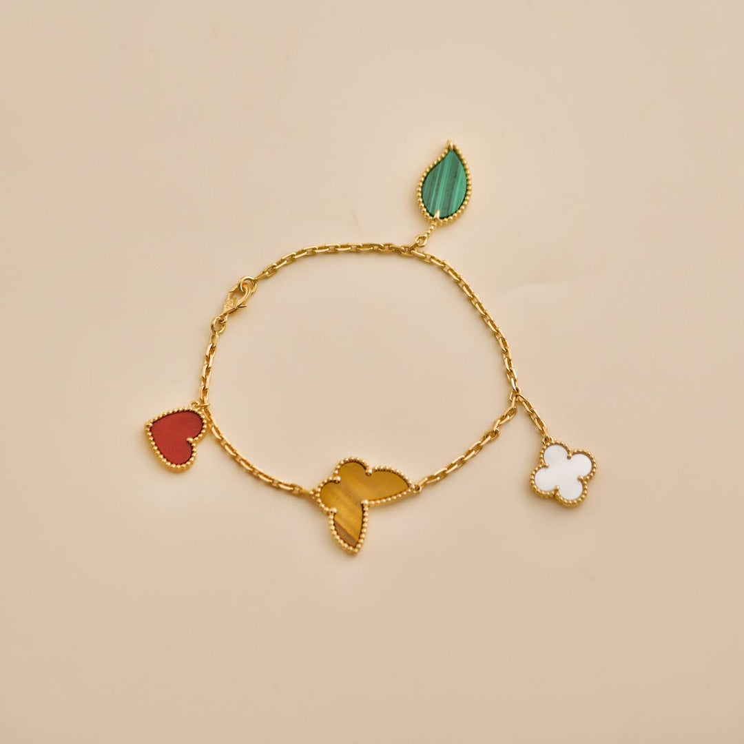 Second Hand Van Cleef & Arpels Lucky Alhambra 4 Motifs 18K Yellow Gold Bracelet