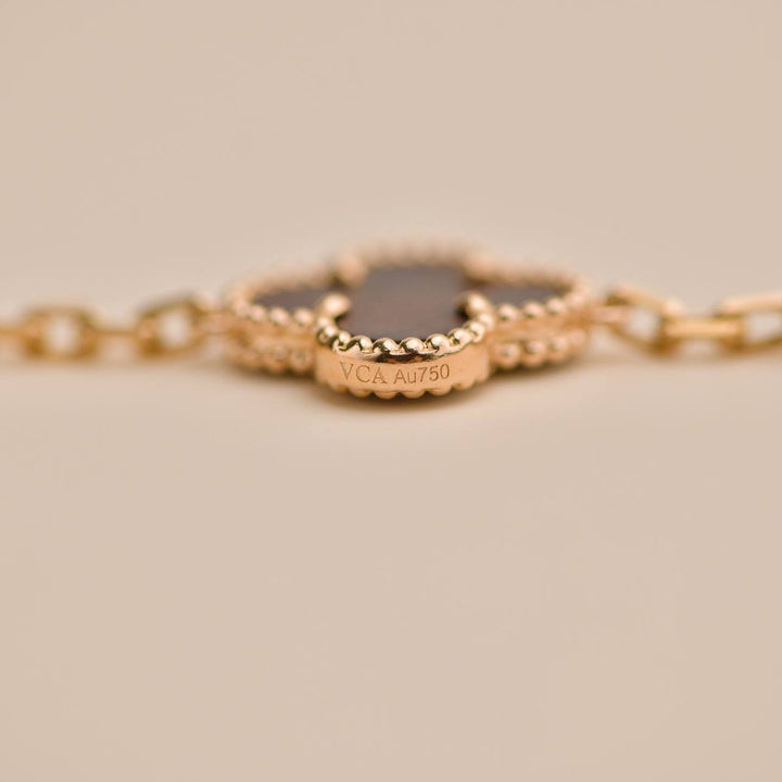 Second Hand Van Cleef Vintage Alhambra Letterwood 5 Motif 18K Yellow Rose Bracelet