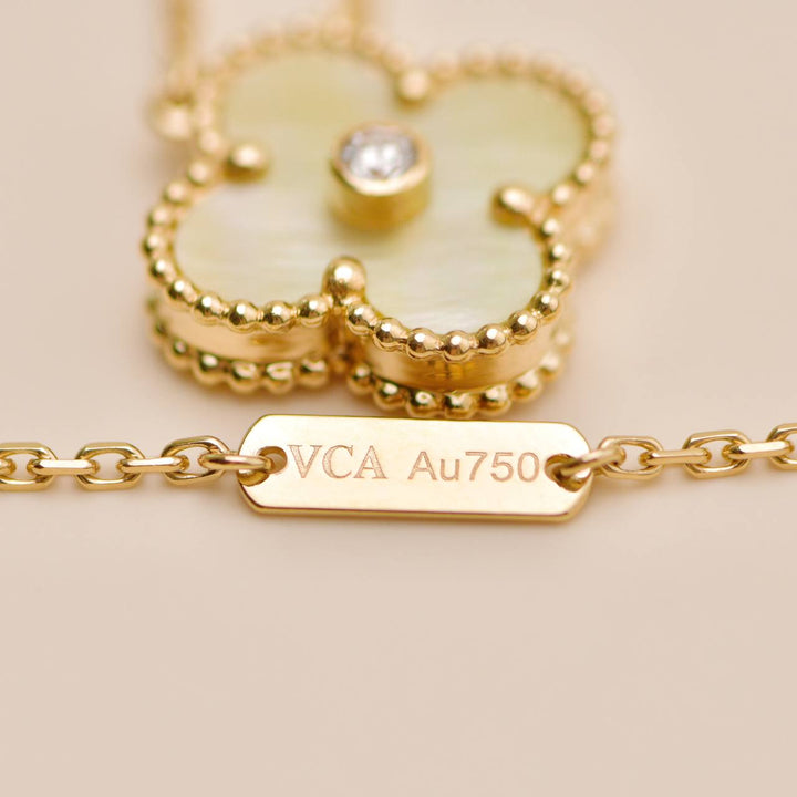Preowned Authentic Van Cleef 2018 Holiday Pendant Golden Mother of Pearl Diamond 18K Yellow Gold