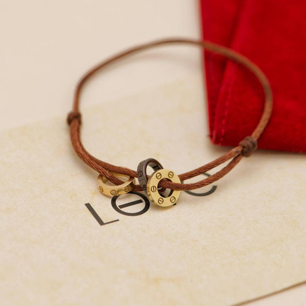 Preowned Authentic Cartier Love 4 Diamond Sèvres Porcelain Brown 18K Yellow & Rose Cord Bracelet
