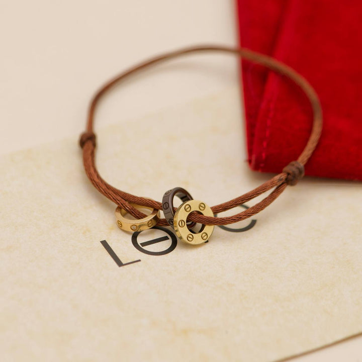 Preowned Authentic Cartier Love 4 Diamond Sèvres Porcelain Brown 18K Yellow & Rose Cord Bracelet