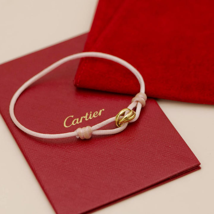 Preowned Authentic Cartier Trinity Cord Bracelet 18K Yellow Gold