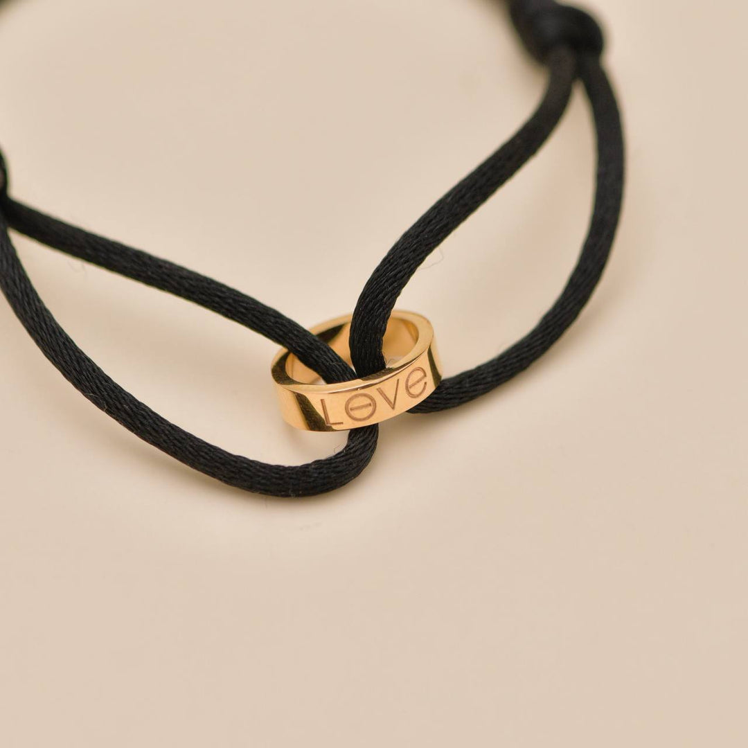 Preloved Cartier Love Cord Bracelet 18K Rose Gold on Black Silk