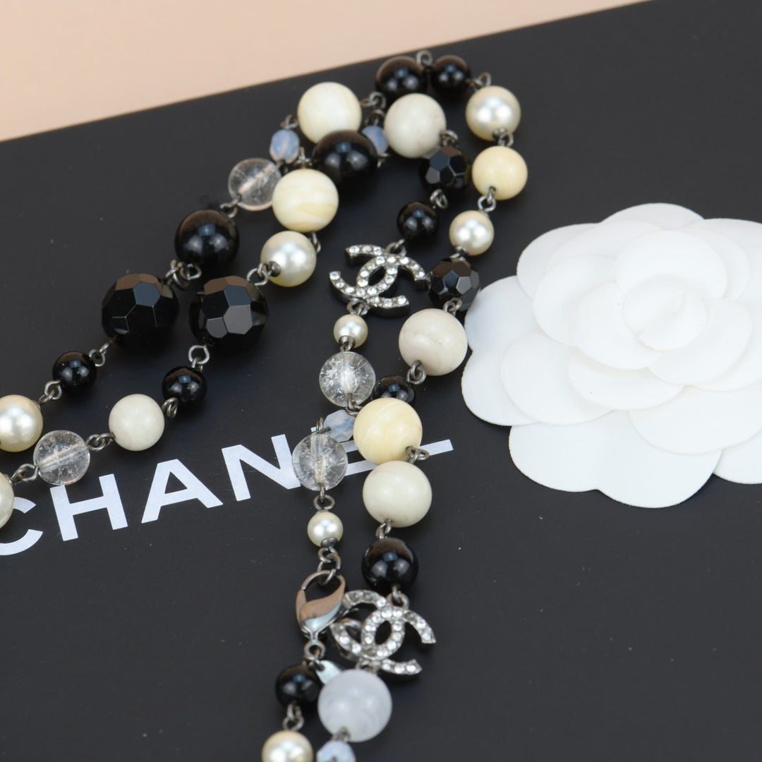 Chanel Black and White CC Logo Faux Pearl Glass Beads Long Necklace –  Madison Avenue Couture