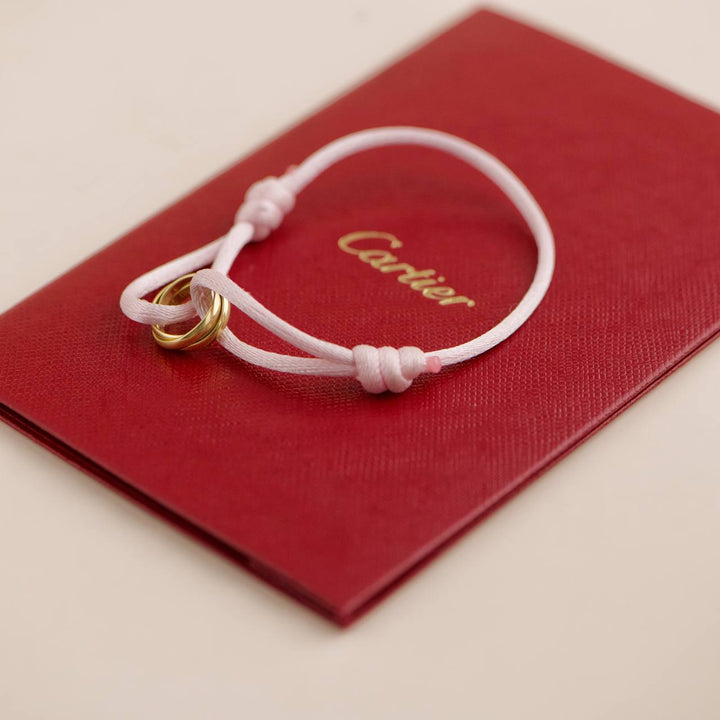 Second Hand Cartier 18K Yellow Gold Trinity Pink Silk Cord Bracelet