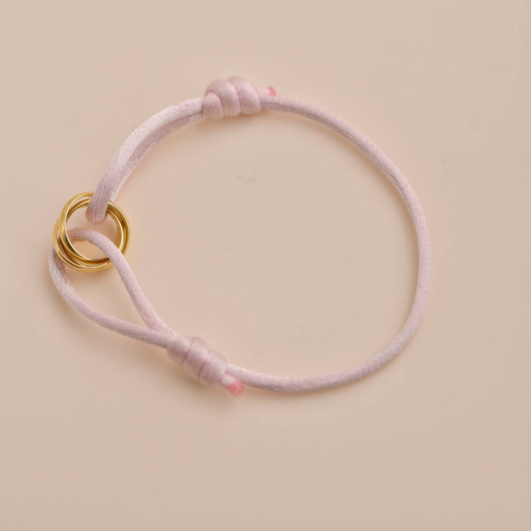 Pre-loved Cartier 18K Yellow Gold Trinity Pink Cord Bracelet