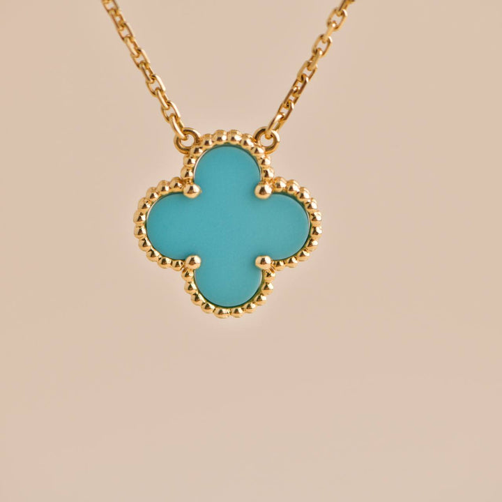 Second-hand Van Cleef & Arpels Vintage Alhambra Turquoise Yellow Gold Pendant Necklace, elegant and timeless.