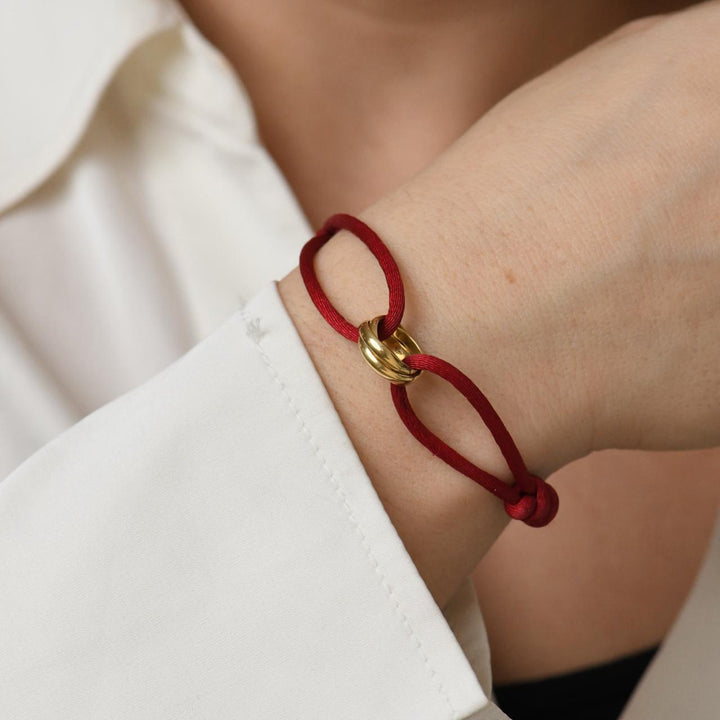Second Hand Cartier Trinity 18K yellow Gold Red Silk Cord Bracelet