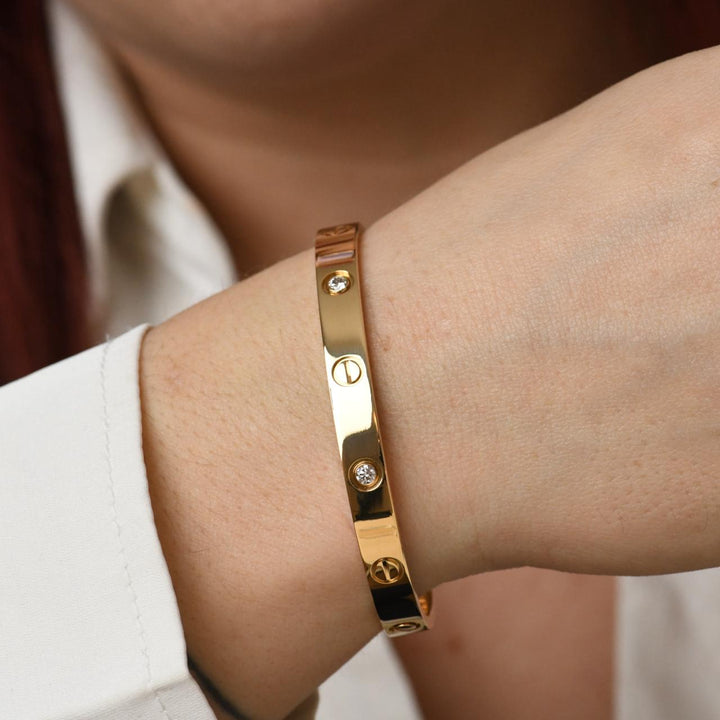 preowned cartier love bracelet yellow gold  4 diamond 