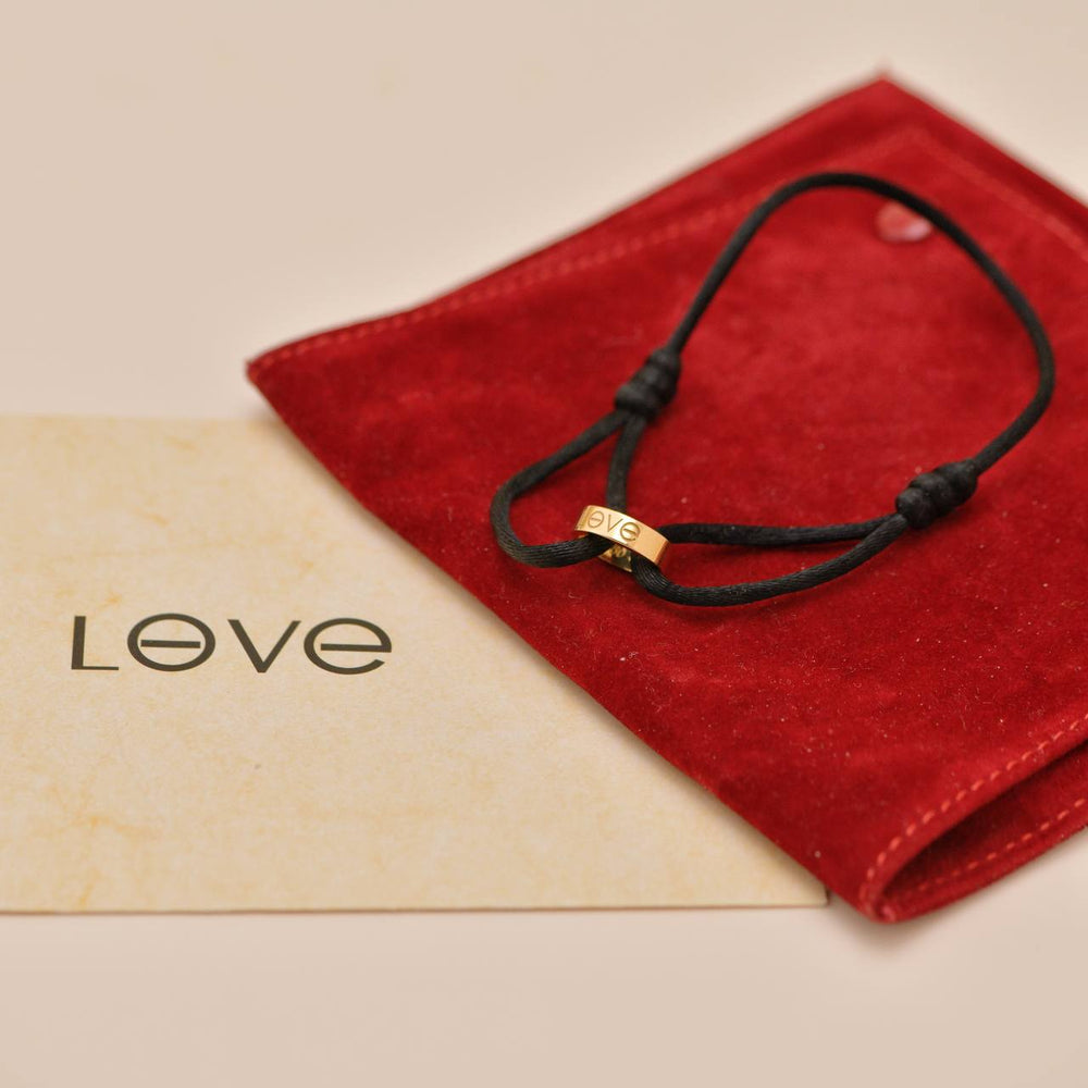 Authentic preloved full set Cartier Love Cord bracelet in 18K rose gold with black adjustable cord