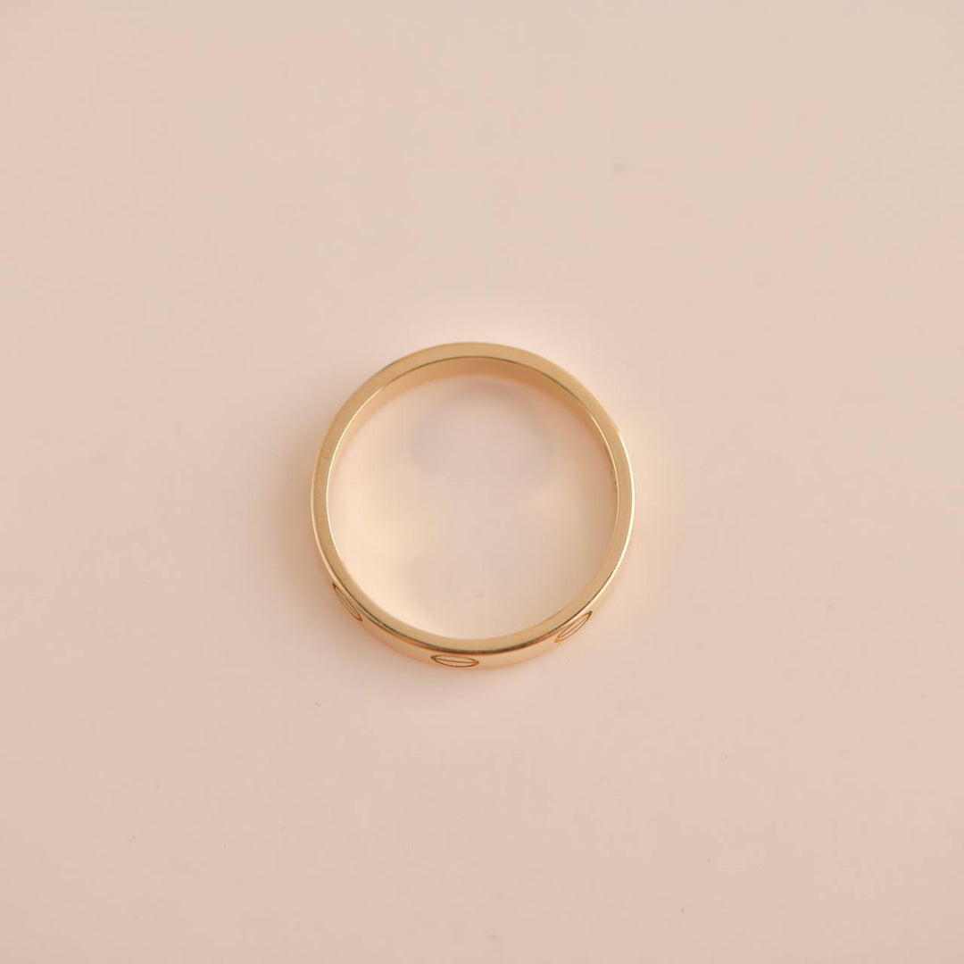 Luxury pre-owned Cartier Love Wedding Band Ring in Yellow Gold, Size 53, perfect for daily wear