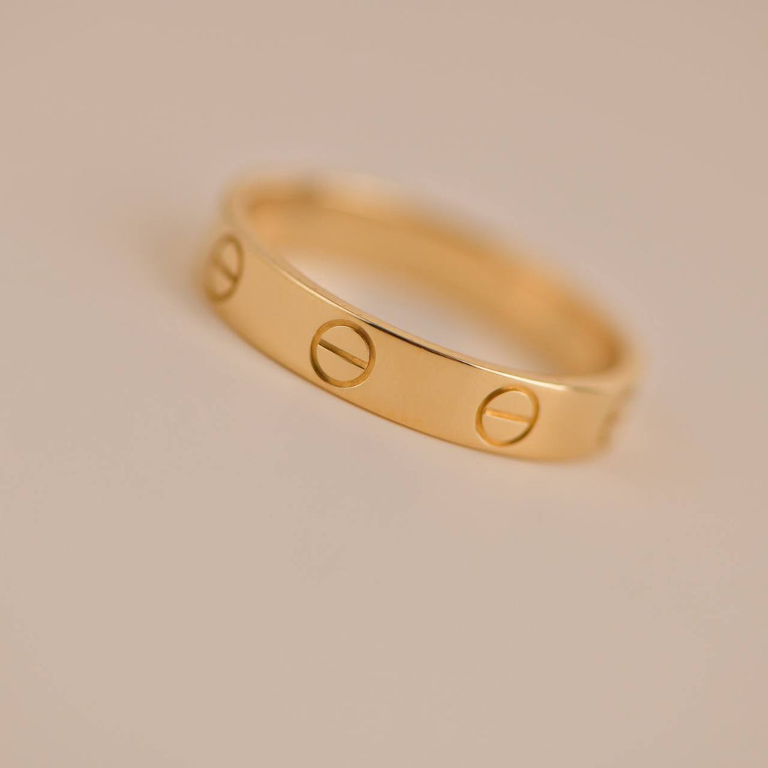 Pre-owned Cartier Love Wedding Band Ring Size 53 in Yellow Gold, a symbol of eternal commitment.