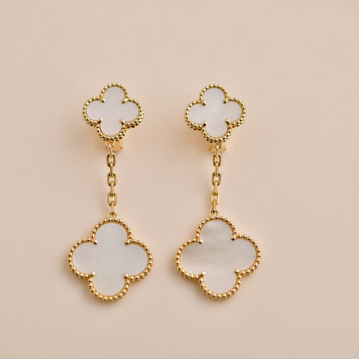 Pre-owned Van Cleef & Arpels Magic Alhambra Two Motifs Mother of Pearl Yellow Gold Earrings, featuring mother of pearl motifs