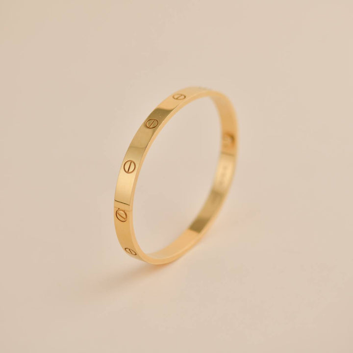 Classic pre-owned Cartier Love Bracelet 18K Yellow Gold Size 18, featuring Cartier's signature design