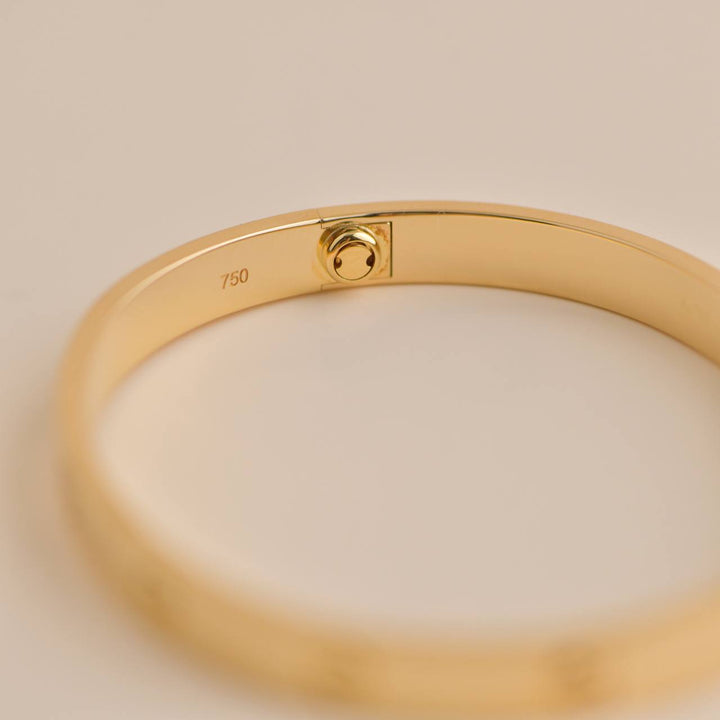 Pre-loved Cartier Love Bracelet 18K Yellow Gold Size 18, symbol of enduring love