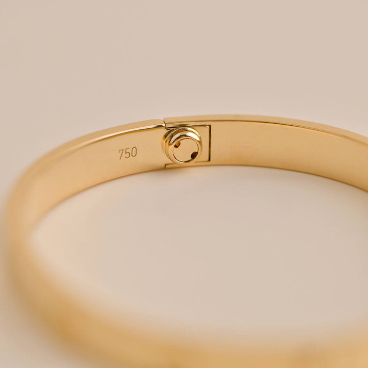 Authentic pre-owned Cartier Love Bracelet 18K Yellow Gold Size 17, a timeless piece.