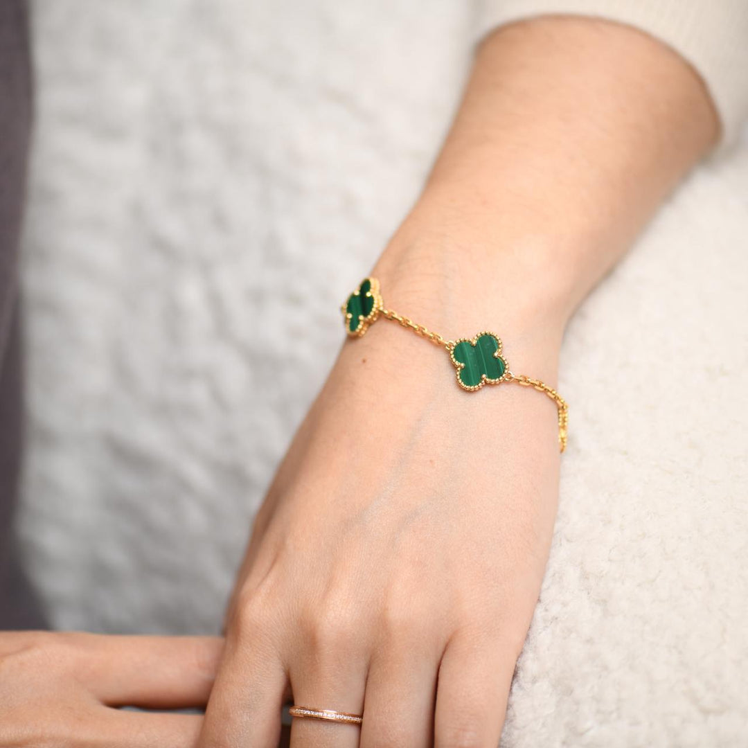 Van Cleef & Arpels 5 Motif Vintage Alhambra Malachite Yellow Gold Bracelet modelling photo