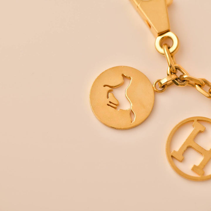Second Hand Hermès Gold plated Breloque Olga Bag Charm