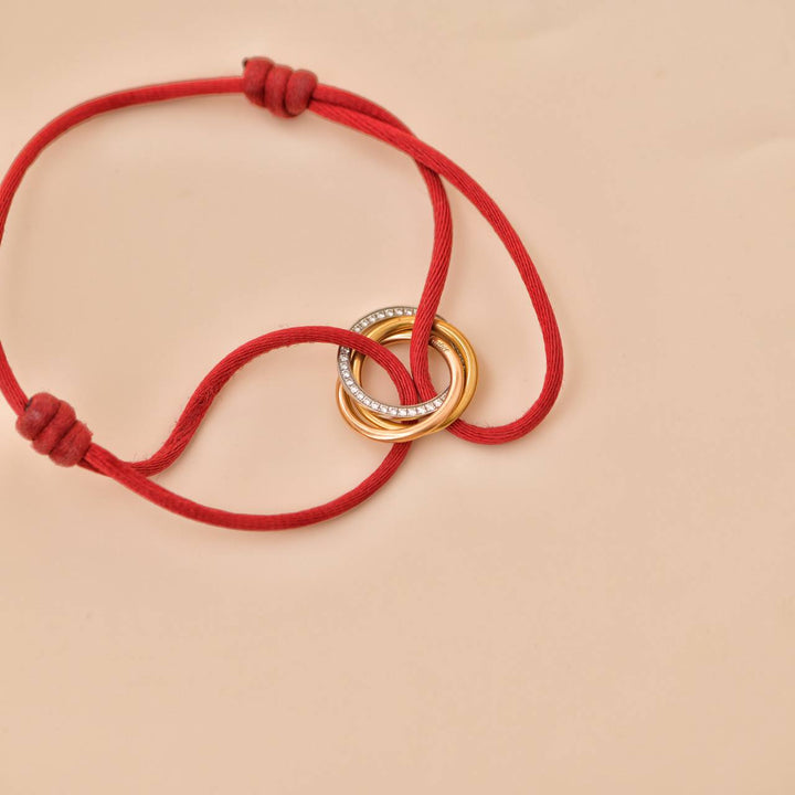 Cartier Trinity Diamond 18K Yellow Rose and White Gold Red Cord Bracelet