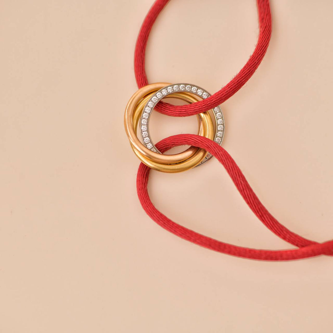 Cartier Trinity Diamond 18K Yellow Rose and White Gold Red Cord Bracelet