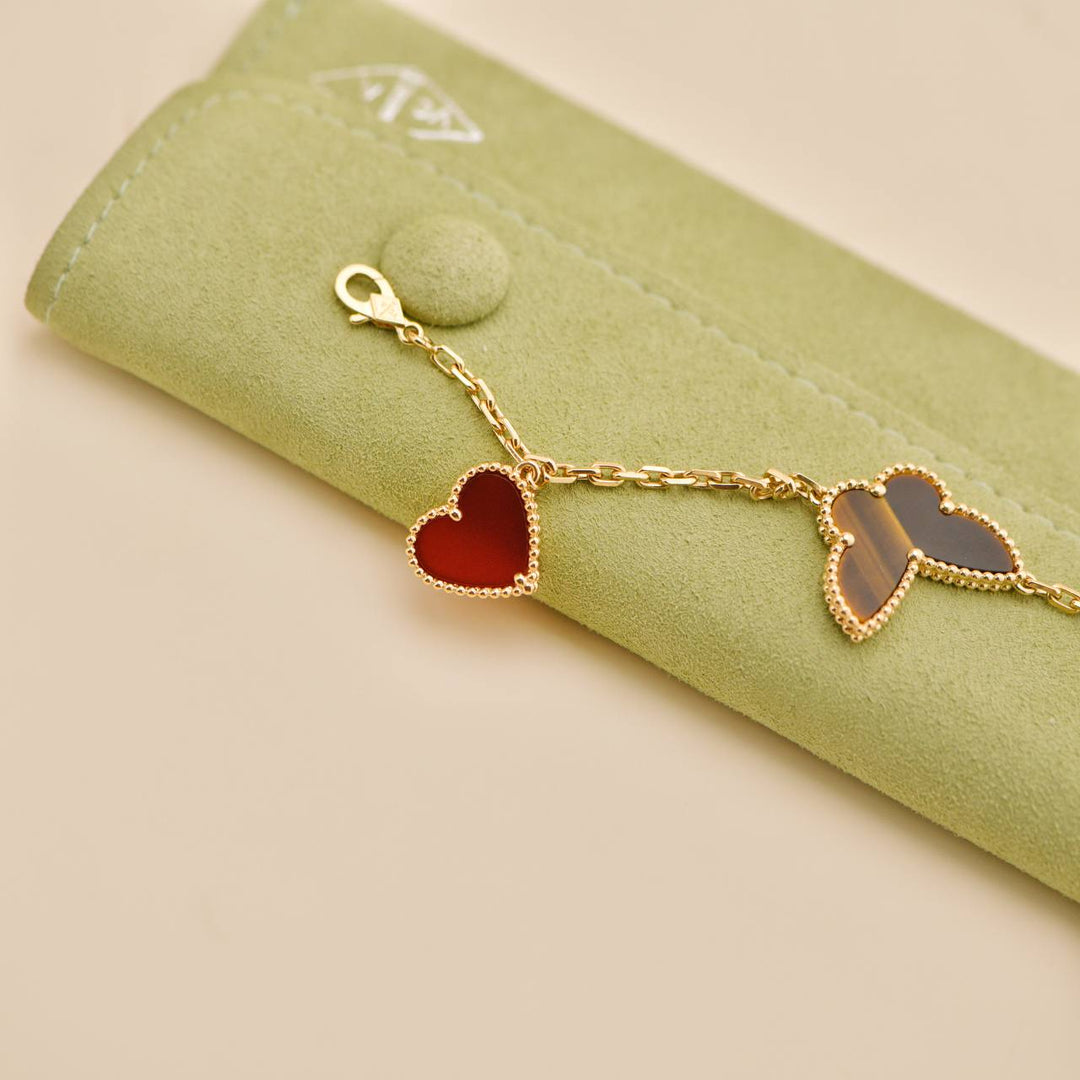 Second Hand Van Cleef & Arpels Lucky Alhambra 4 Motifs 18K Yellow Gold Bracelet
