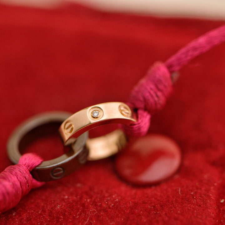 Preowned Cartier Love 4 Diamond 18K Rose Gold Sevres Porcelain Silk Cord Bracelet