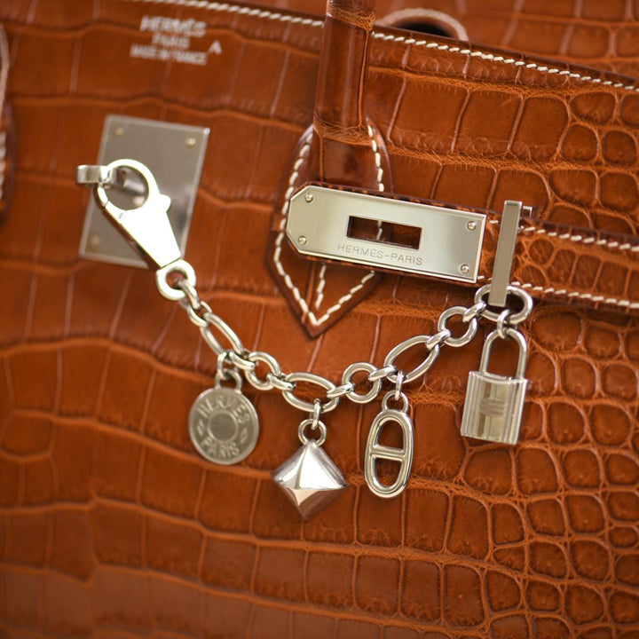 Preloved Hermès Permabrass Olga Palladium Plated Bag Charm