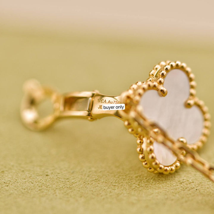 Preowned Van Cleef Magic Alhambra Two Motif Mother of Pearl 18K Gold Earrings
