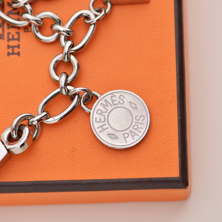 Second Hand Hermès Permabrass Olga Palladium Plated Bag Charm