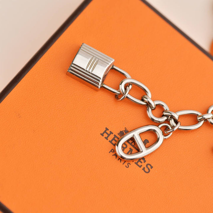 Preloved Hermès Permabrass Olga Palladium Plated Bag Charm