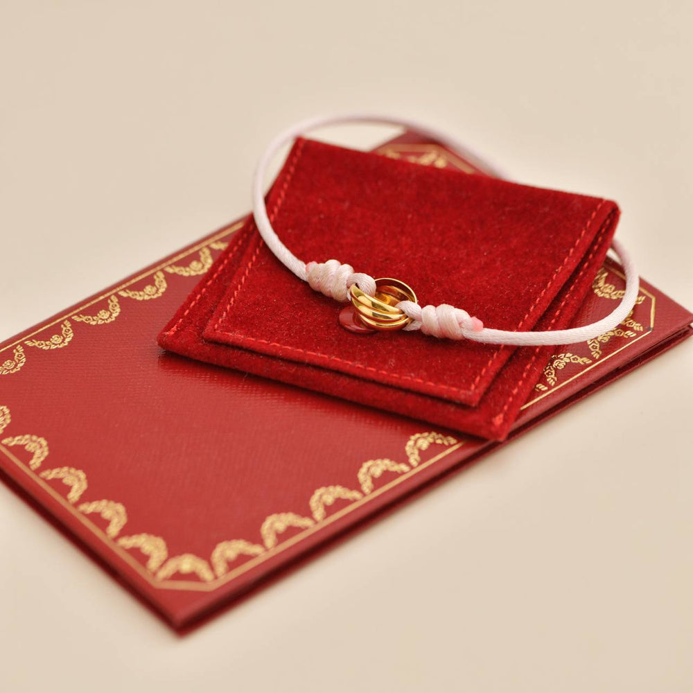 Preowned Cartier Trinity 18K Yellow Gold Pink Silk Cord Bracelet