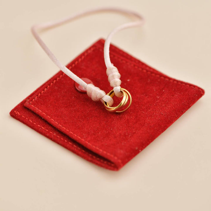 Used Cartier Trinity 18K Yellow Gold Pink Silk Cord Bracelet