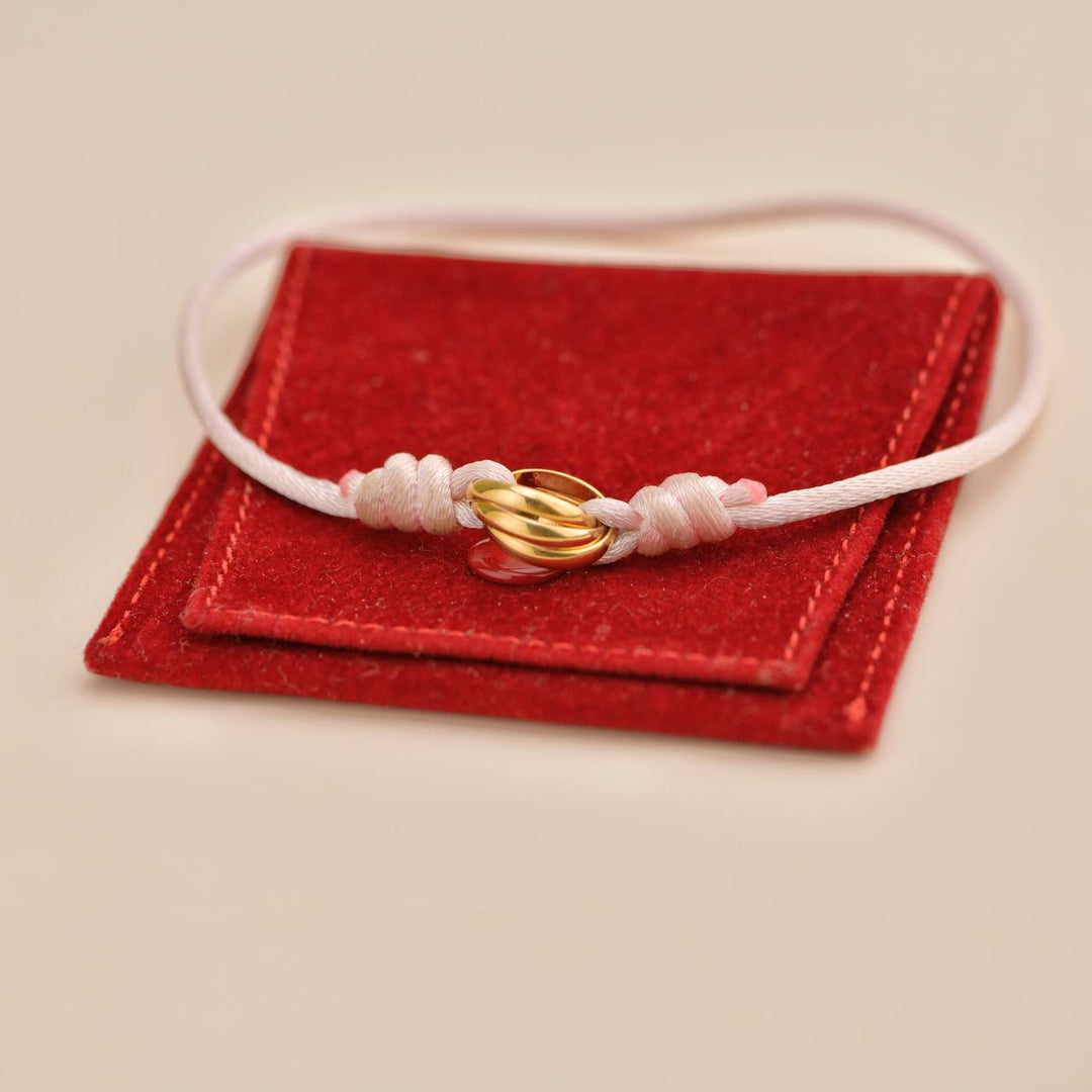 Preloved Cartier Trinity 18K Yellow Gold Silk Cord Bracelet