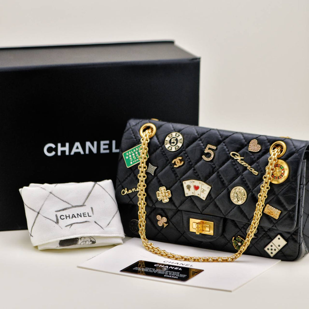 Preowned Authentic Full set Chanel Limited Edition 2.55 Reissue 225 Lucky Charms Double Flap Bag Aged Calfskin Leather Black