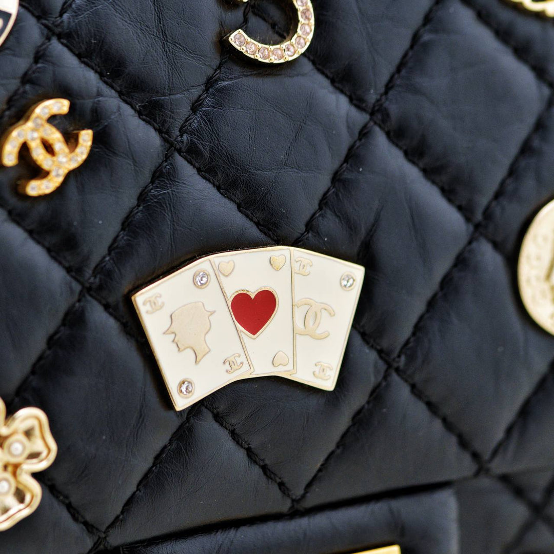 Preowned Authentic Chanel Limited Edition 2.55 Reissue 225 Lucky Charms Double Flap Black Leather Bag Full set 