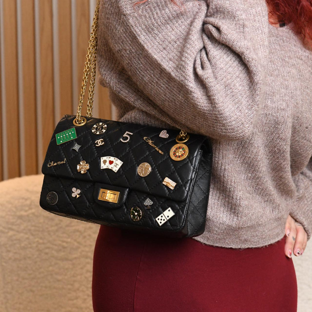 Preowned Authentic Chanel 2.55 Reissue 225 Lucky Charms Calfskin Double Flap Bag