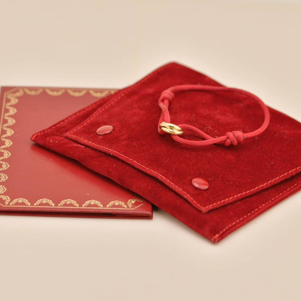 Preowned Authentic Full Set Cartier Trinity Red Silk Cord Bracelet 18K yellow Gold