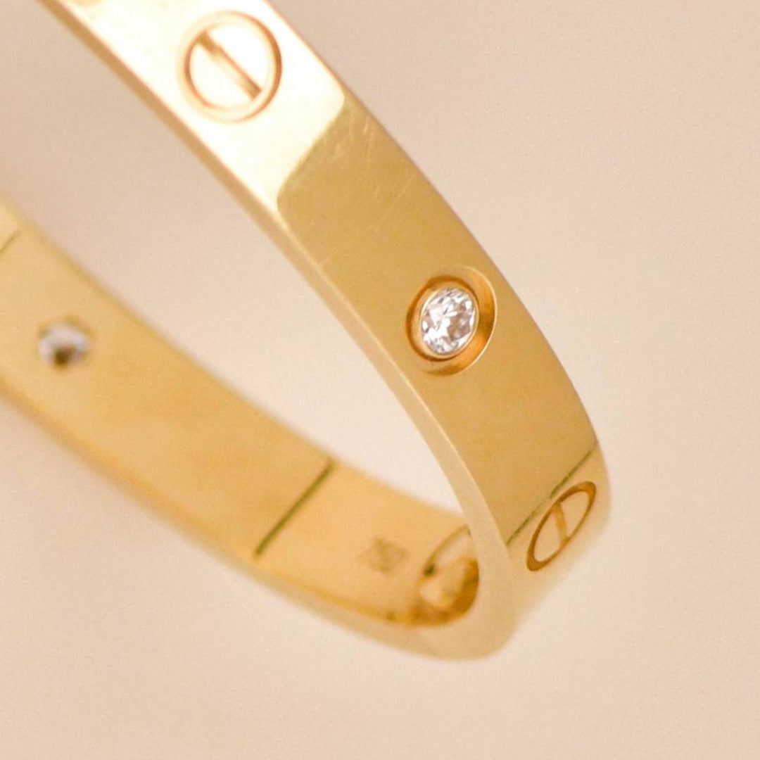 Preowned Cartier Love 4 Diamond Classic Model Bracelet Size 17 18K Yellow Gold