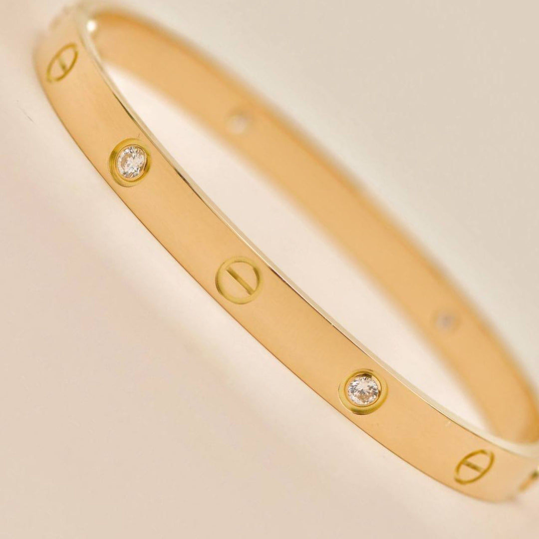 Preowned Cartier Love 4 Diamond Classic Model Bracelet Size 18 18K Yellow Gold