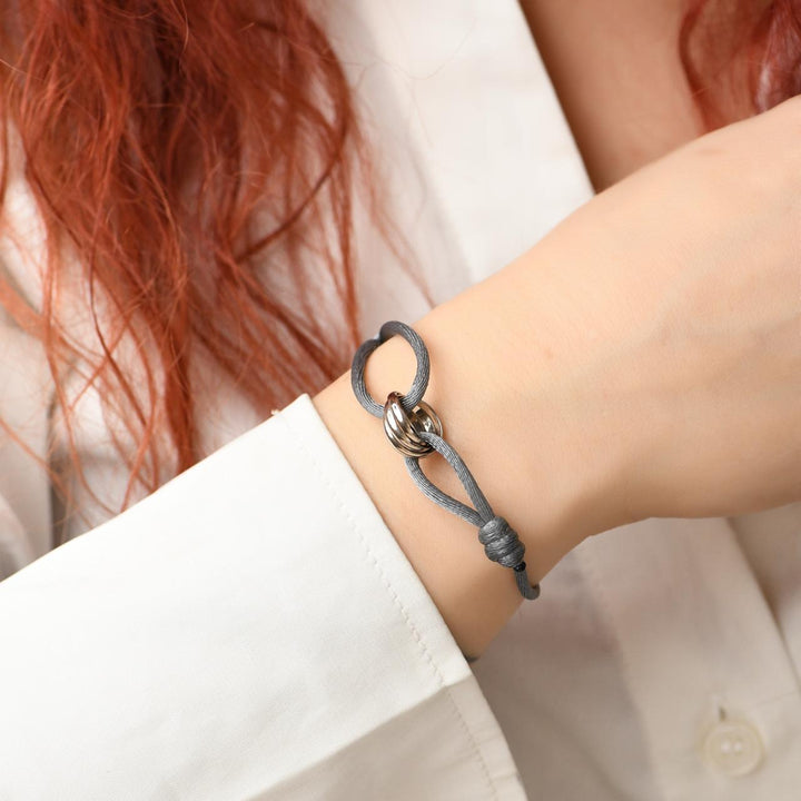 Authentic Second Hand Cartier Trinity Grey Cord Bracelet 18K White Gold