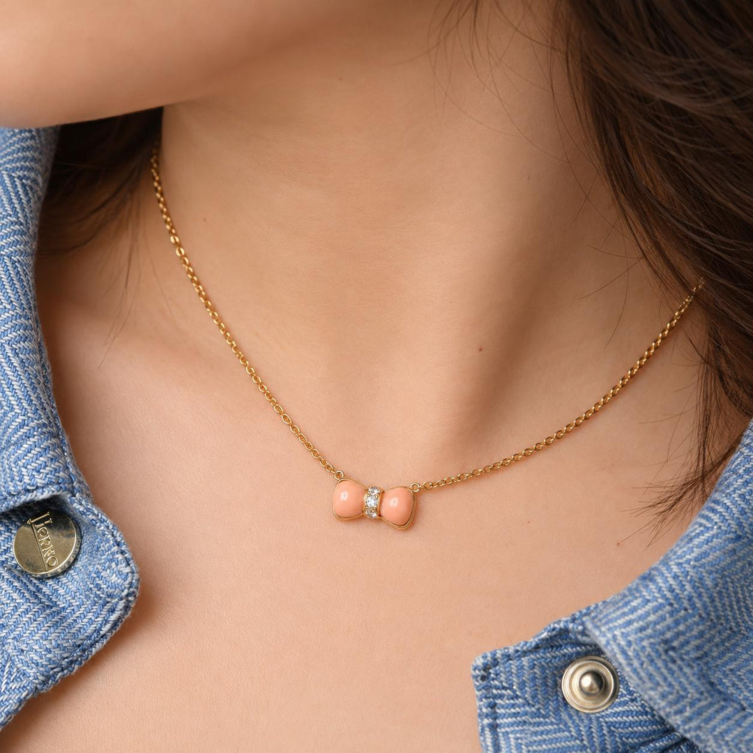 Authentic Preowned Van Cleef & Arpels Coral & Diamond Bow Pendant Necklace 18K Yellow Gold
