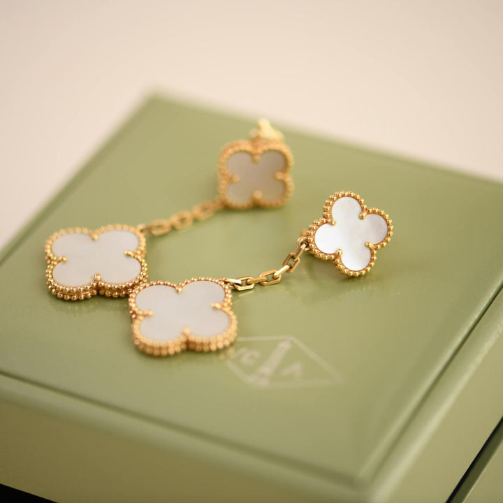 Second Hand Van Cleef Magic Alhambra Two Motifs Mother of Pearl Yellow Gold Earrings