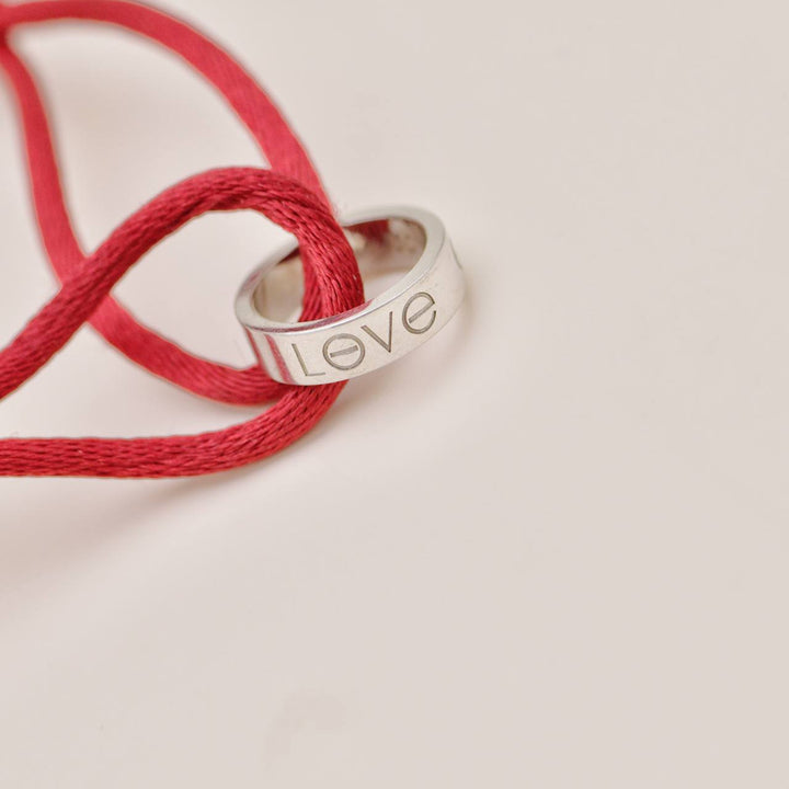 Second Hand Authentic Cartier Love Cord Bracelet 18K White Gold on Red Silk