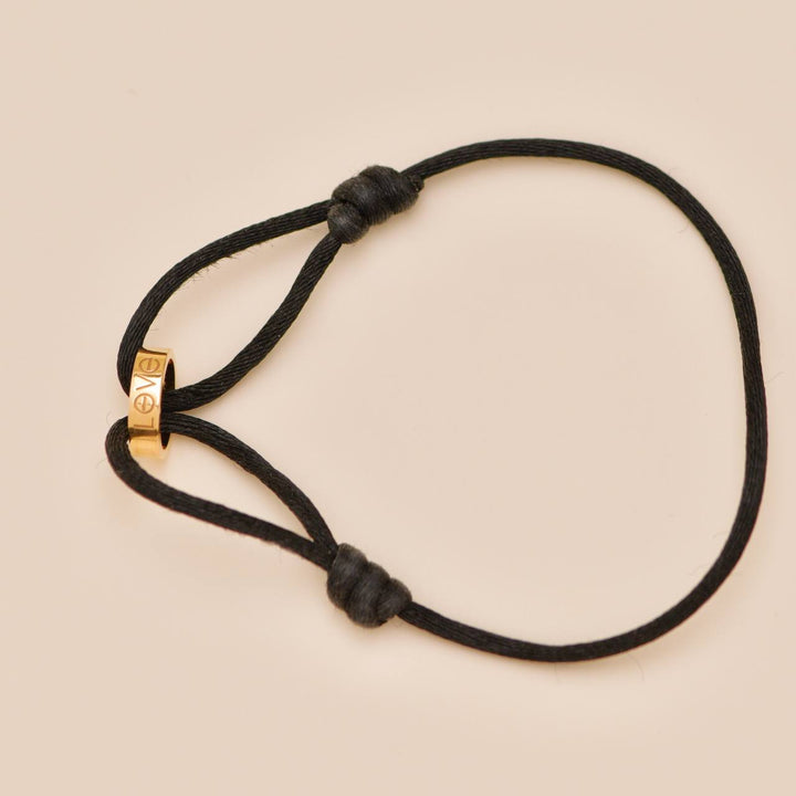 Authentic Preloved Cartier Love Cord bracelet in 18K rose gold with black adjustable cord
