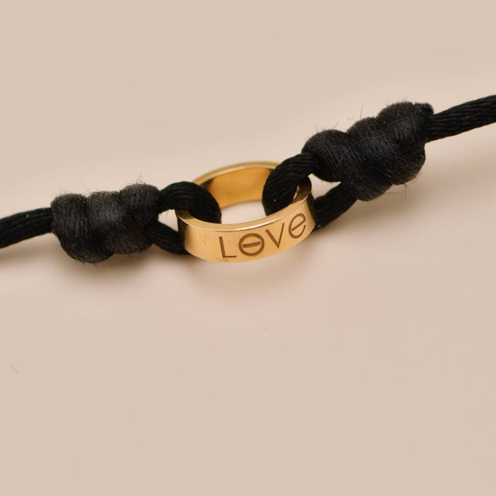 Authentic Preowned Cartier Love Cord bracelet in 18K rose gold with black adjustable cord