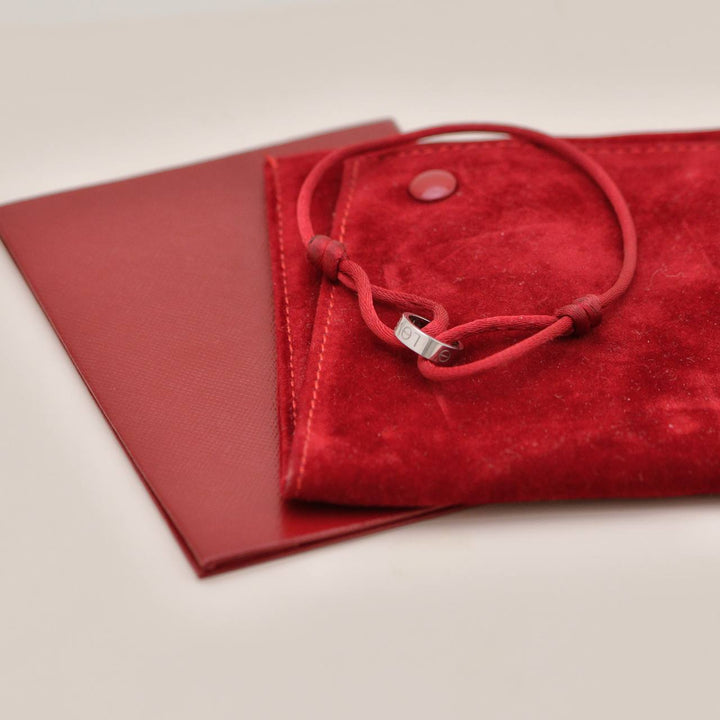 Preowned Authentic Cartier Love Cord Bracelet 18K White Gold on Red Silk