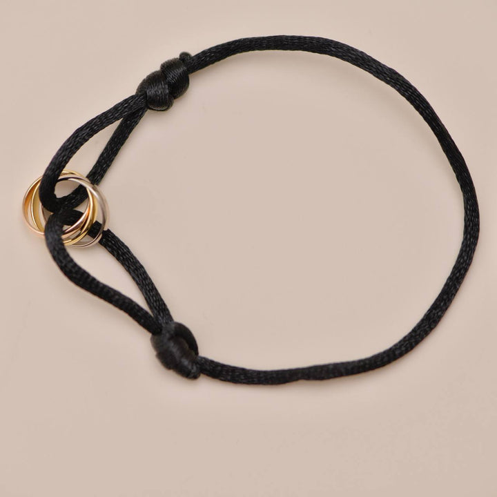 Second Hand Cartier Trinity 18K White, Rose and Yellow Gold Black Cord Bracelet