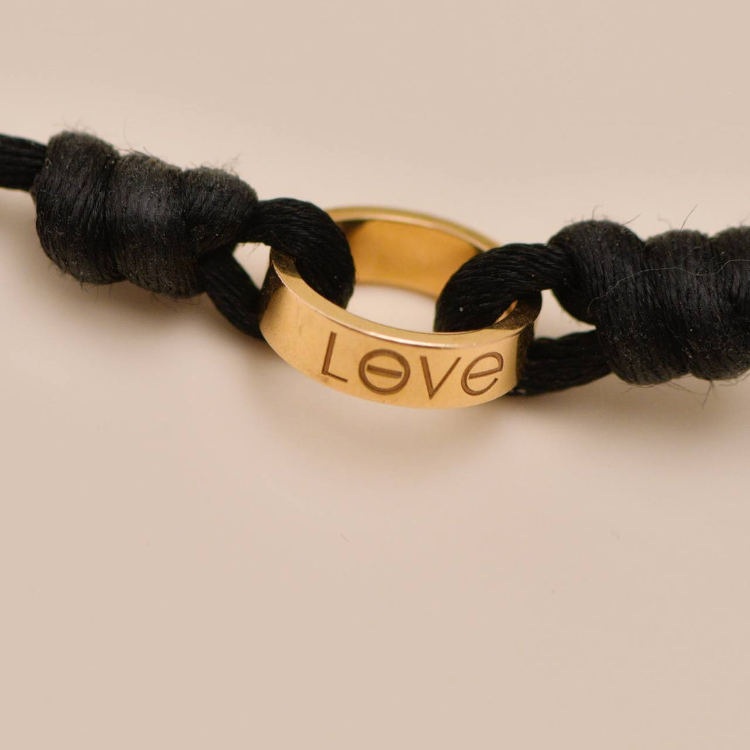 Authentic Cartier Love Cord bracelet in 18K rose gold with black adjustable cord